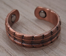 Load image into Gallery viewer, Copper bracelet on a wooden surface
