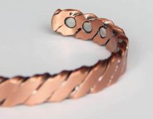 Load image into Gallery viewer, close up of the magnets on the copper bangle