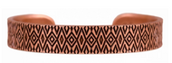 Copper bracelet with geometric pattern on a white background