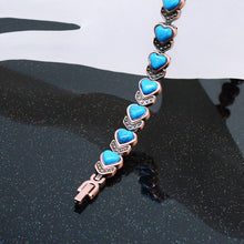 Load image into Gallery viewer, realistic view of a copper magnetic bracelet with blue heart shapedstones
