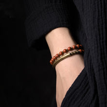 Load image into Gallery viewer, close up of Multi-Layered Stone Handcrafted Copper Bracelet on a person
